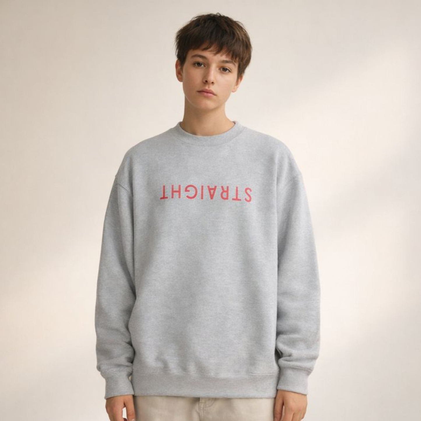 Light gray unisex crewneck sweatshirt with upside-down STRAIGHT typography print, minimalist streetwear style.