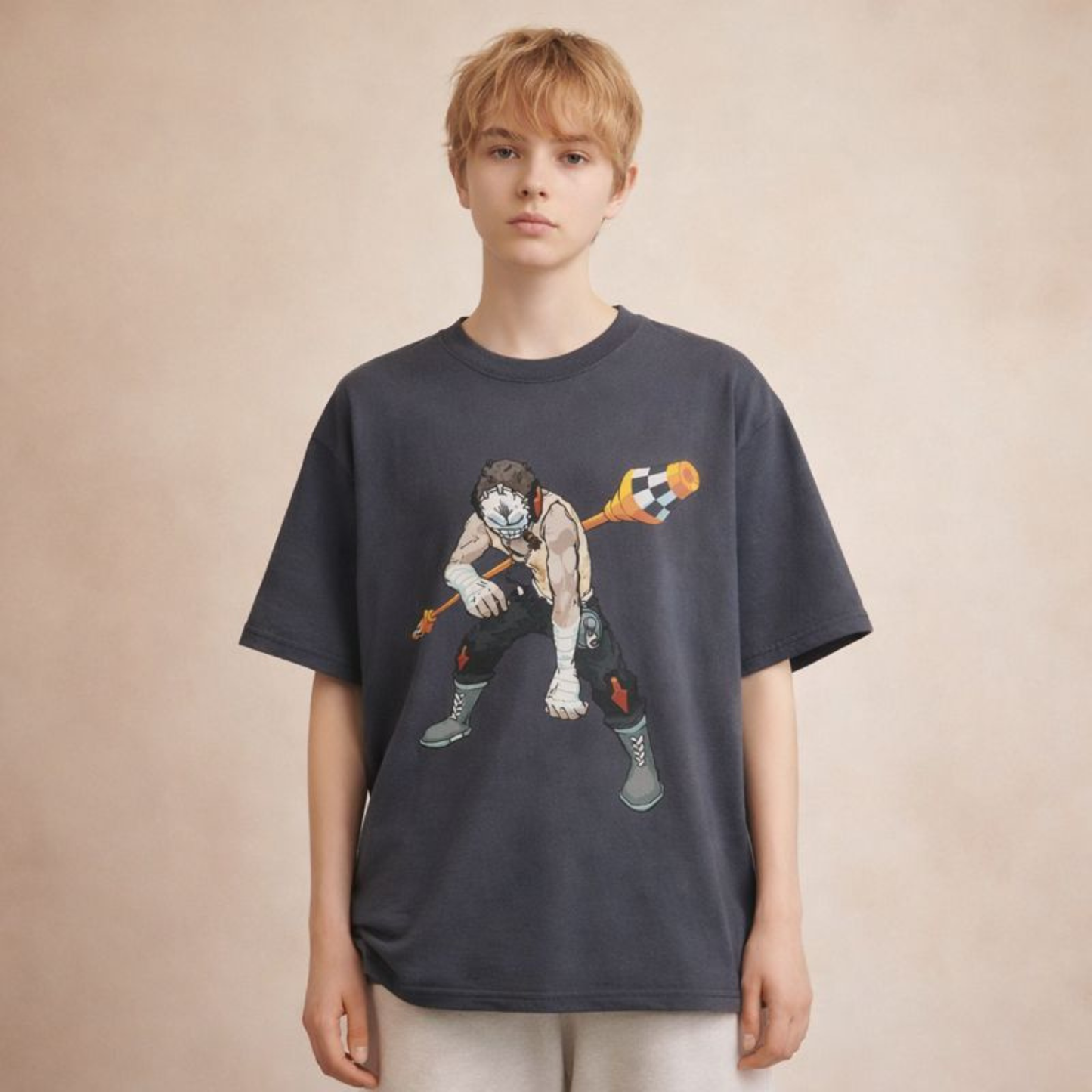 Charcoal grey oversized streetwear t-shirt with illustrated comic warrior graphic, styled on unisex model in soft studio light