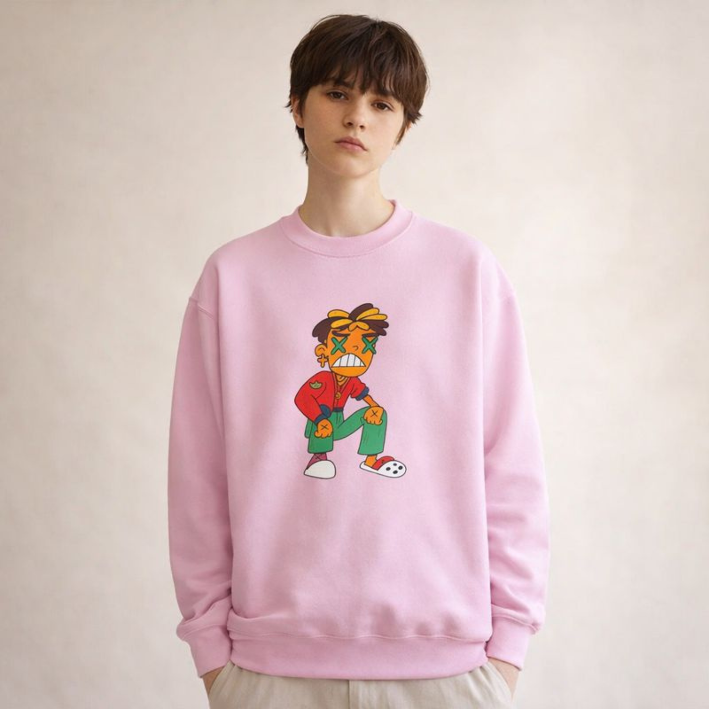 Soft pink unisex sweatshirt featuring a hand-drawn cartoon character design, modern streetwear look.